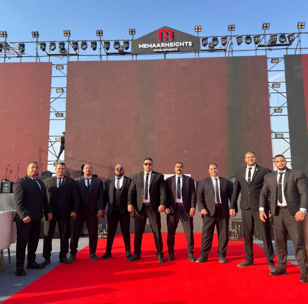 Golden Guard event security team — nine Egyptian guards on red carpet at corporate event