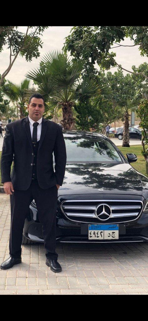 Golden Guard bodyguard with black Mercedes VIP car rental Egypt