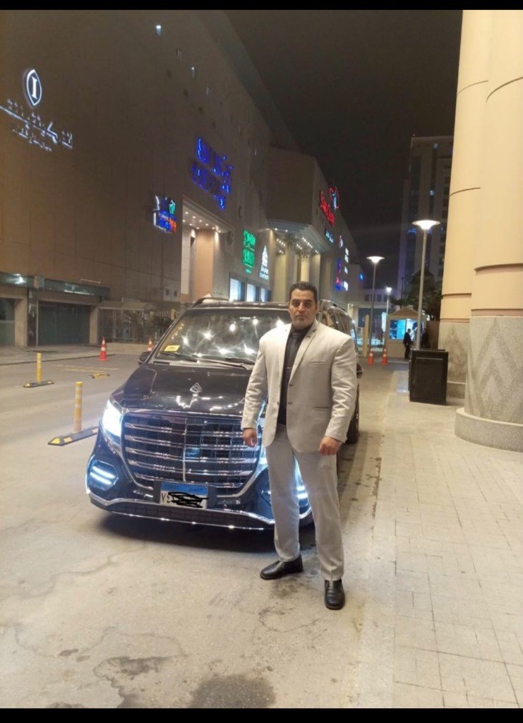 Golden Guard VIP luxury van rental with security guard at night Egypt